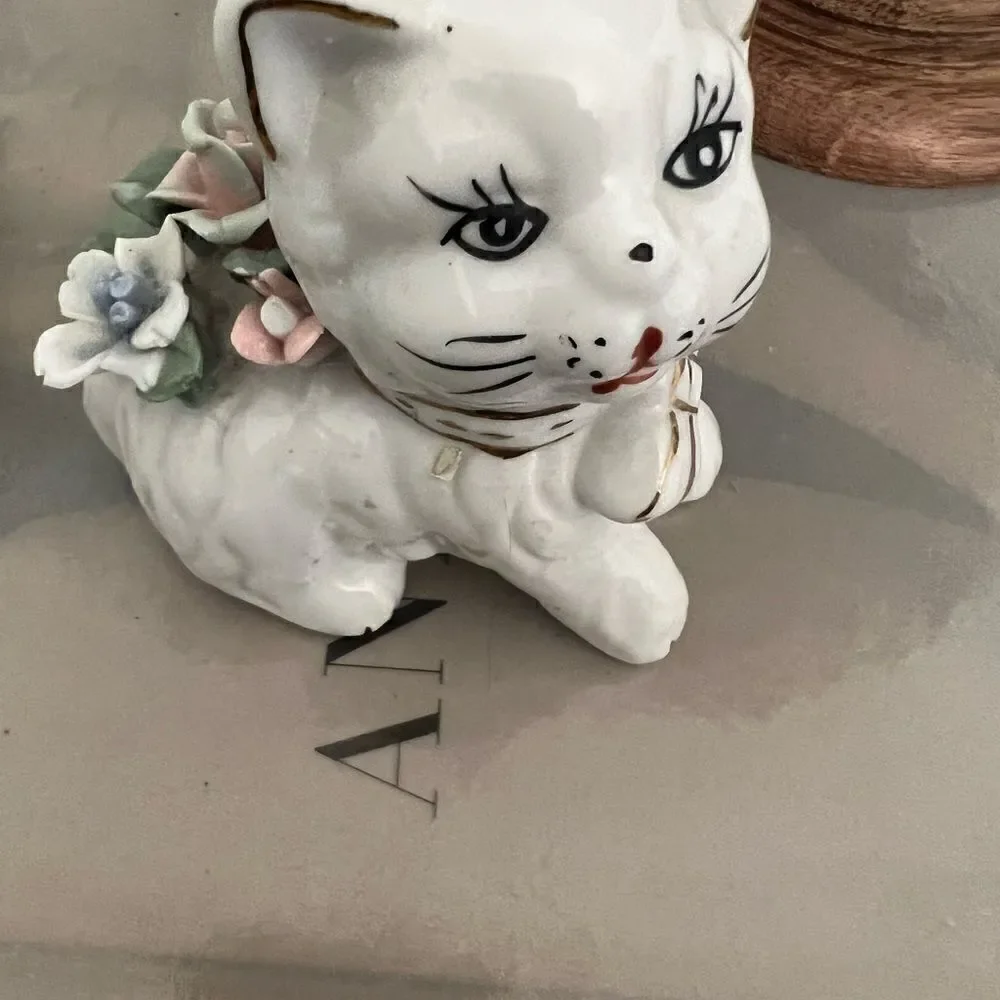 Set of two vintage small ceramic white and floral cats.